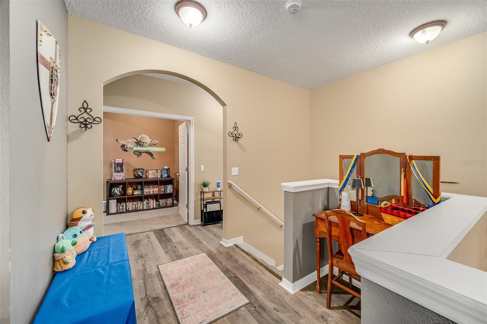 Stairway up to loft, movie room and additional bedrooms/bathrooms - 2711 CYPRESS TREE TRL, ST CLOUD