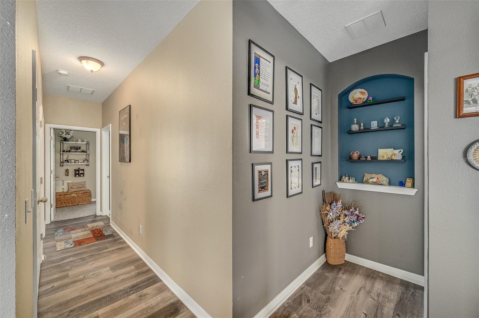 Hallway to additional Primary Suite to the right and additional 2 bedrooms and bathroom to the left - 2711 CYPRESS TREE TRL, ST CLOUD