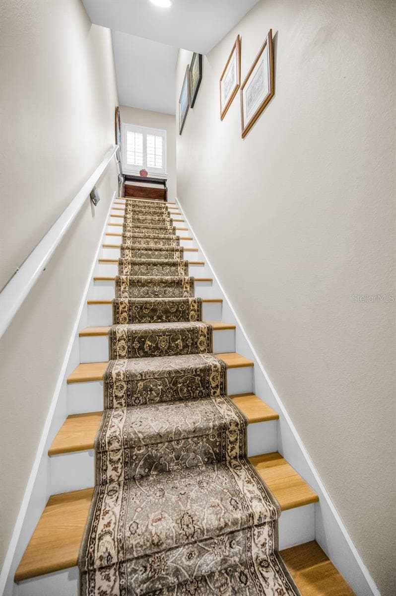 Entrance to your extra living space. The reinforced stair railing can accommodate a chair lift. - 732 NE OAK ST, ST PETERSBURG