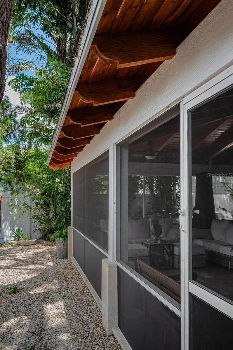 Surrounding the massive pool area are solid Redwood handcrafted corbels. - 732 NE OAK ST, ST PETERSBURG