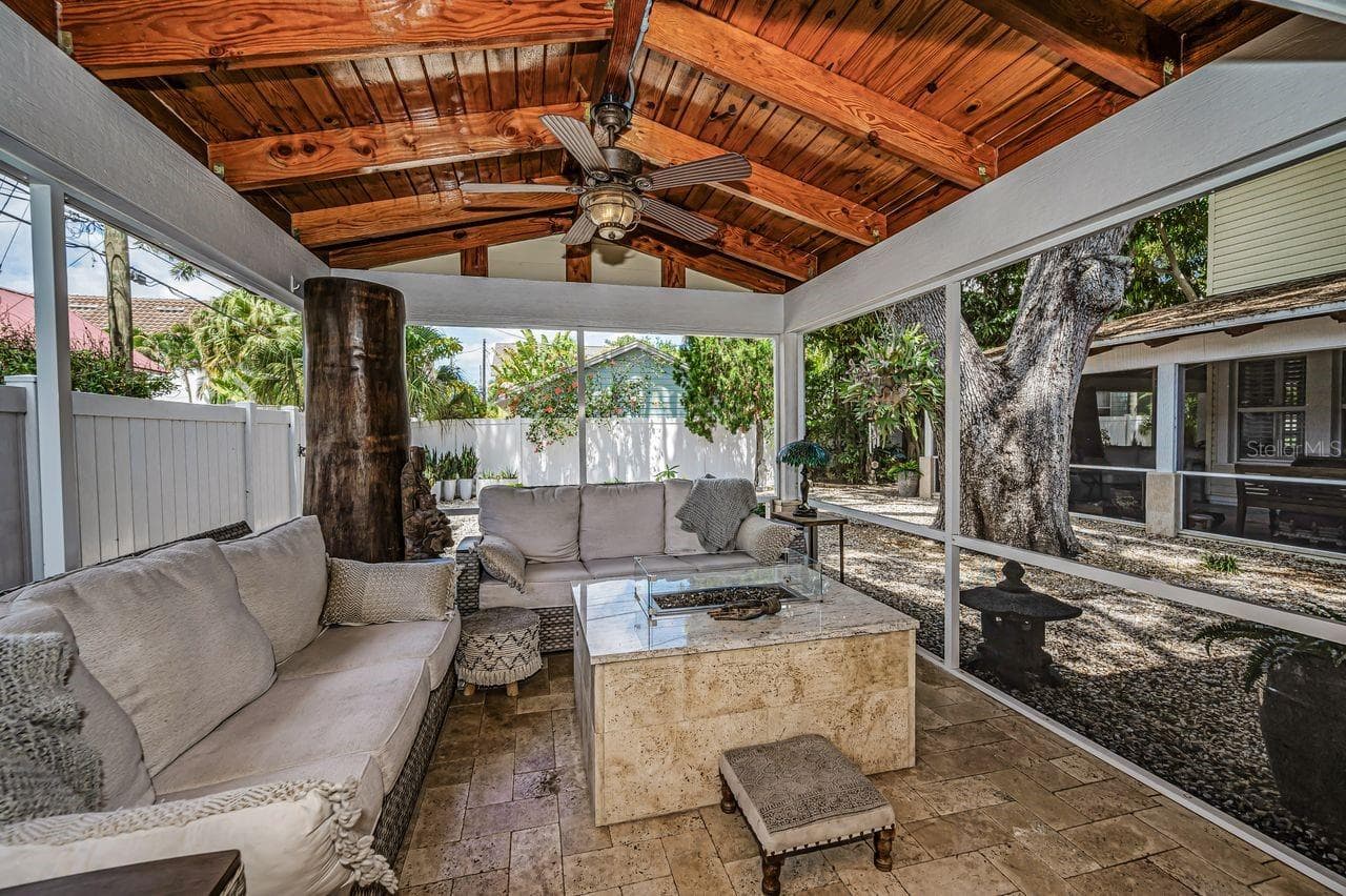 A space to relax around a gas firepit. Feels international, inviting, and beautifully framed - 732 NE OAK ST, ST PETERSBURG