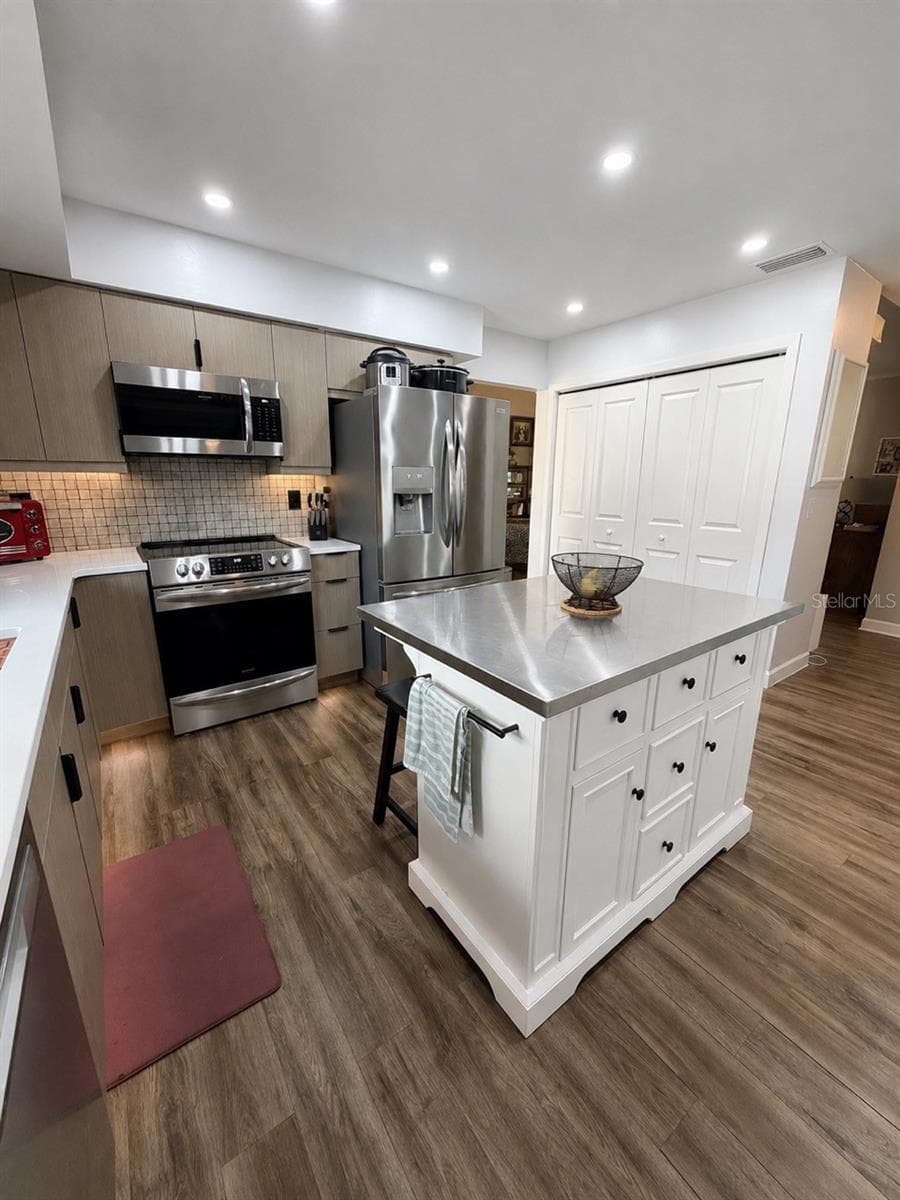 The island gives you more storage and area for meal prep. Large pantry and plenty of cabinet space! - 15705 CASHMERE LN, TAMPA