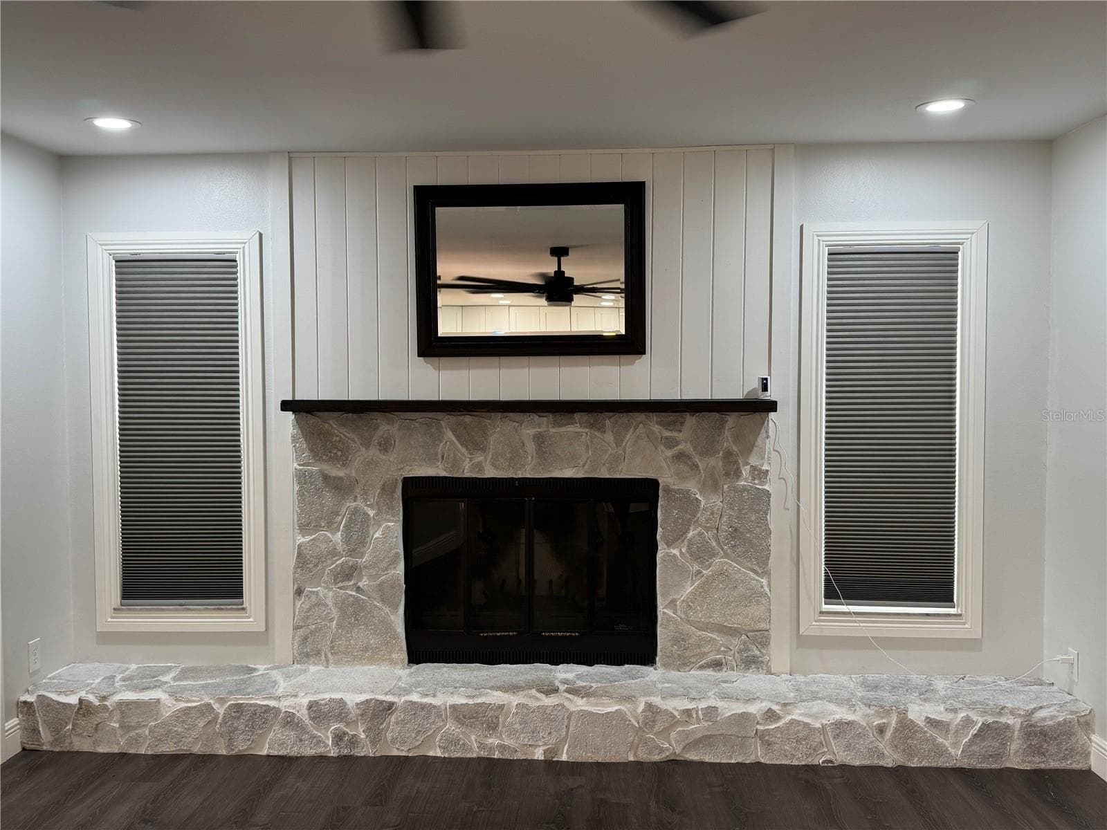 Beautiful fireplace featuring a large, elegant mantle and custom stonework. - 1809 STELLA CT N, LAKELAND