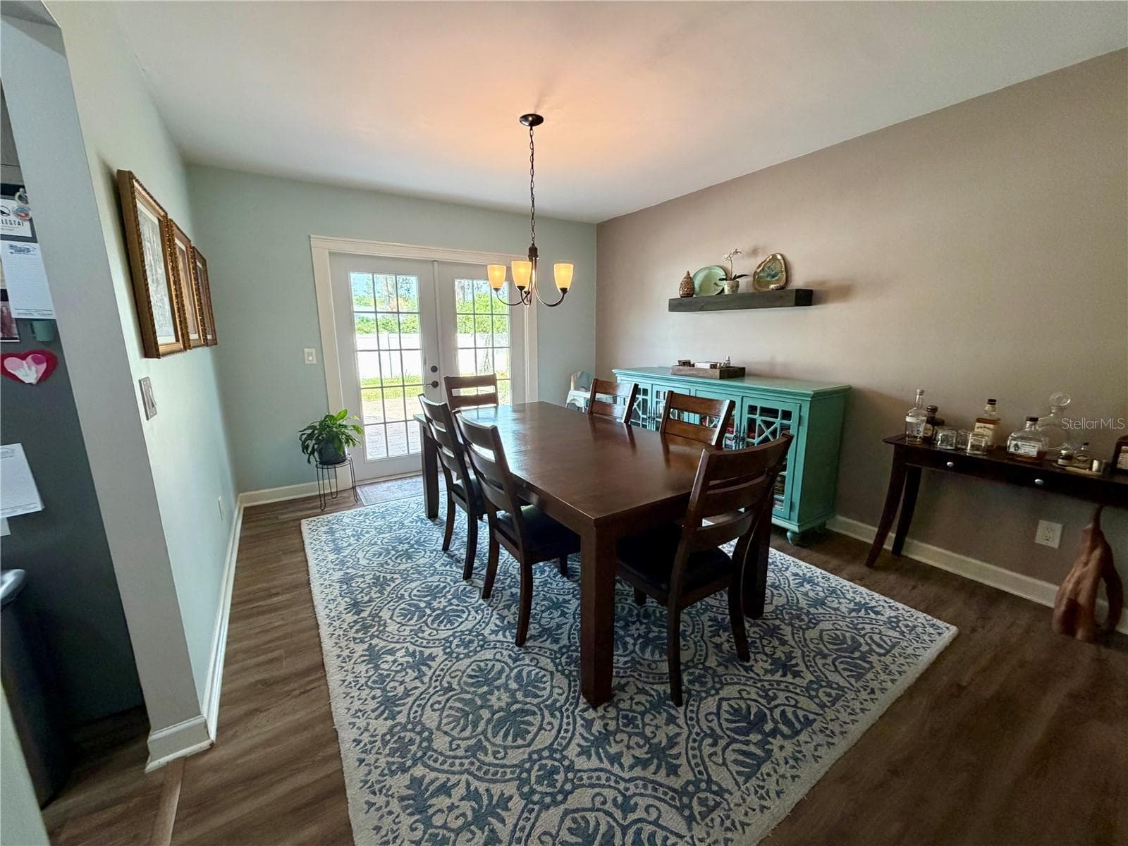Large dining room accommodates plenty of furniture and French Doors lead to the paver patio - 15705 CASHMERE LN, TAMPA