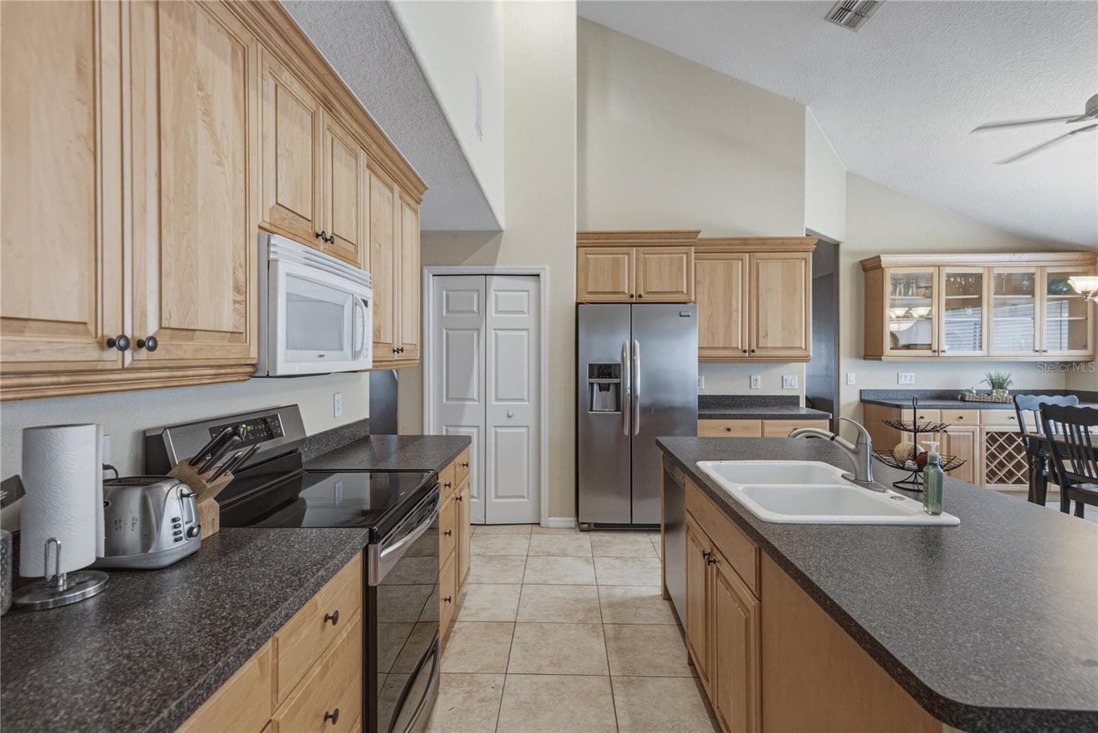 Kitchen with eat at space at island - 2024 LARKSPUR CT, TRINITY