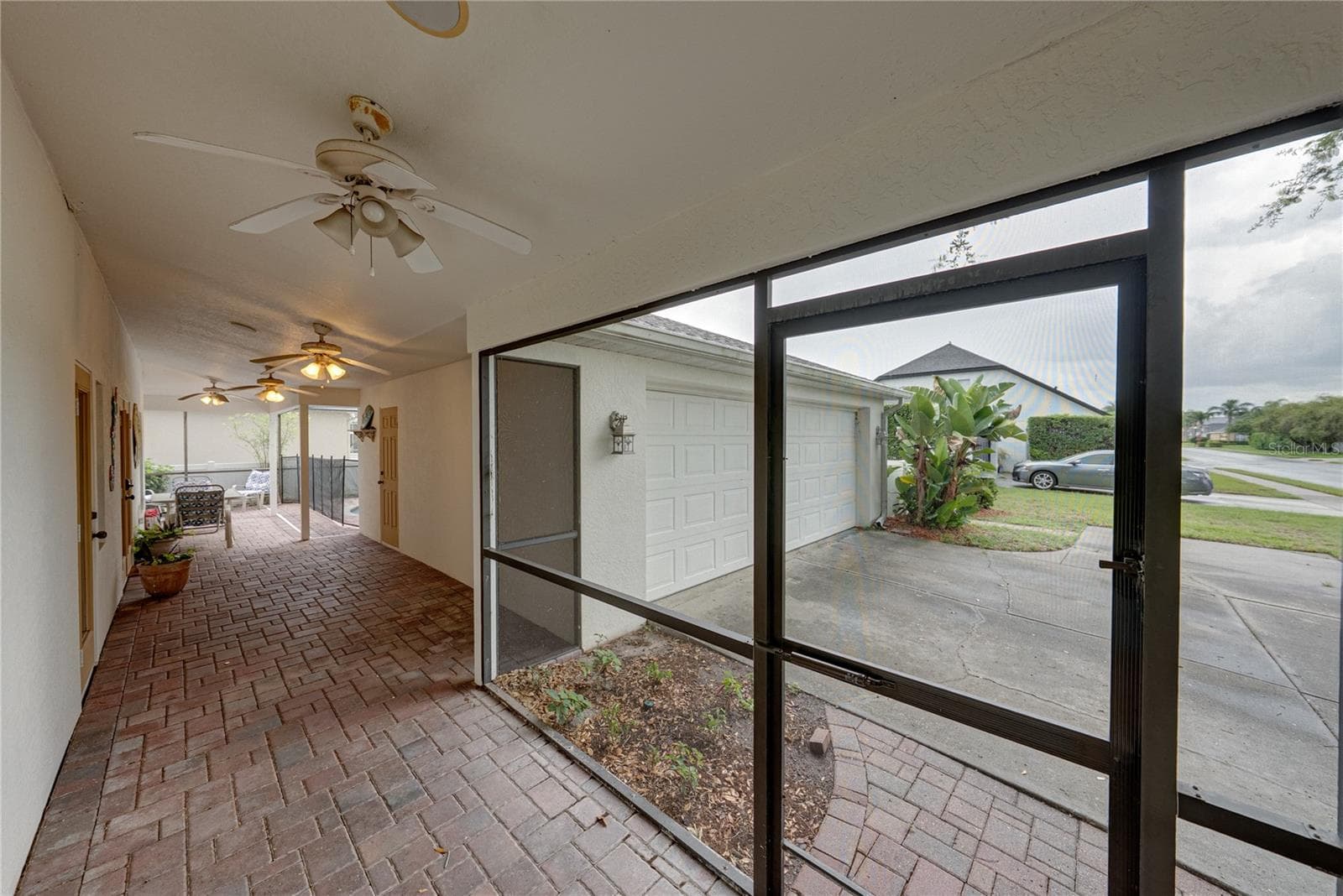 Breezeway between home and detached garage - 2024 LARKSPUR CT, TRINITY