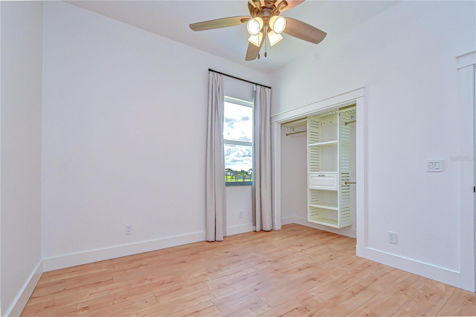 Comfortable secondary bedroom with upgraded flooring. - 4008 MCINTOSH ESTATES LN, PLANT CITY