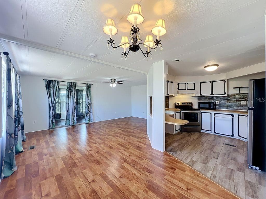 Open concept - Dining room, Living room and Kitchen - 1203 APACHE CIR, TAVARES