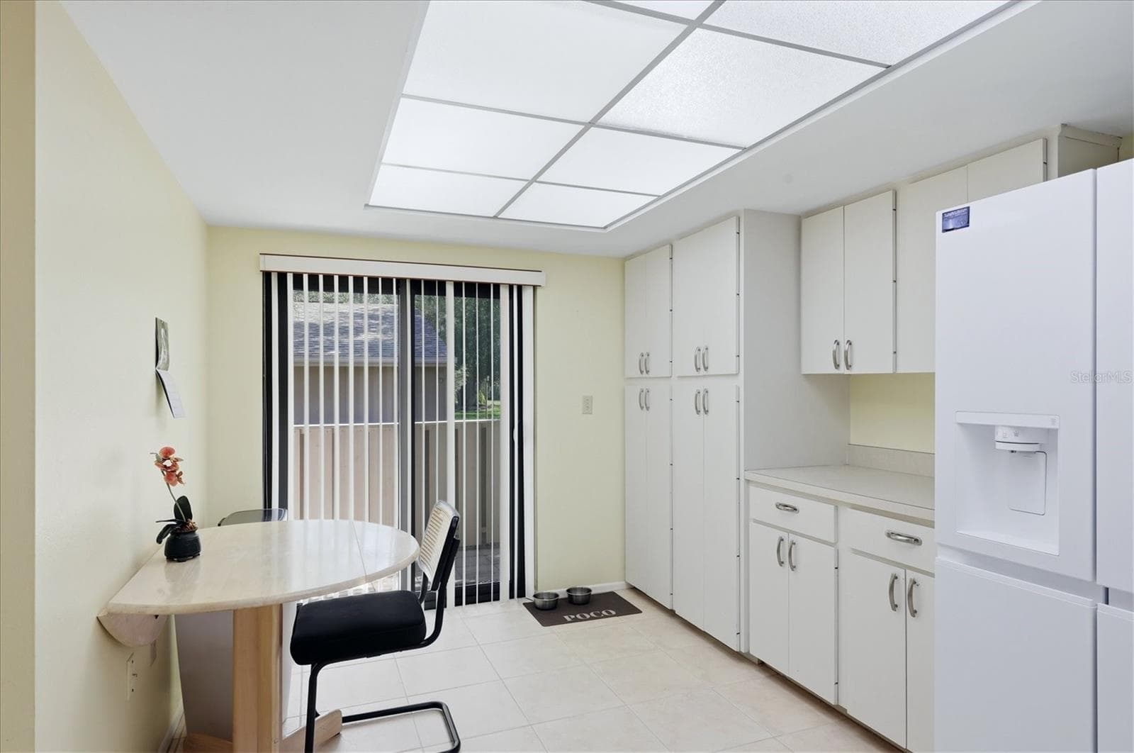 Eat in kitchen with plenty of cabinetry/pantry - 3412 TALLYWOOD CIR #7018, SARASOTA