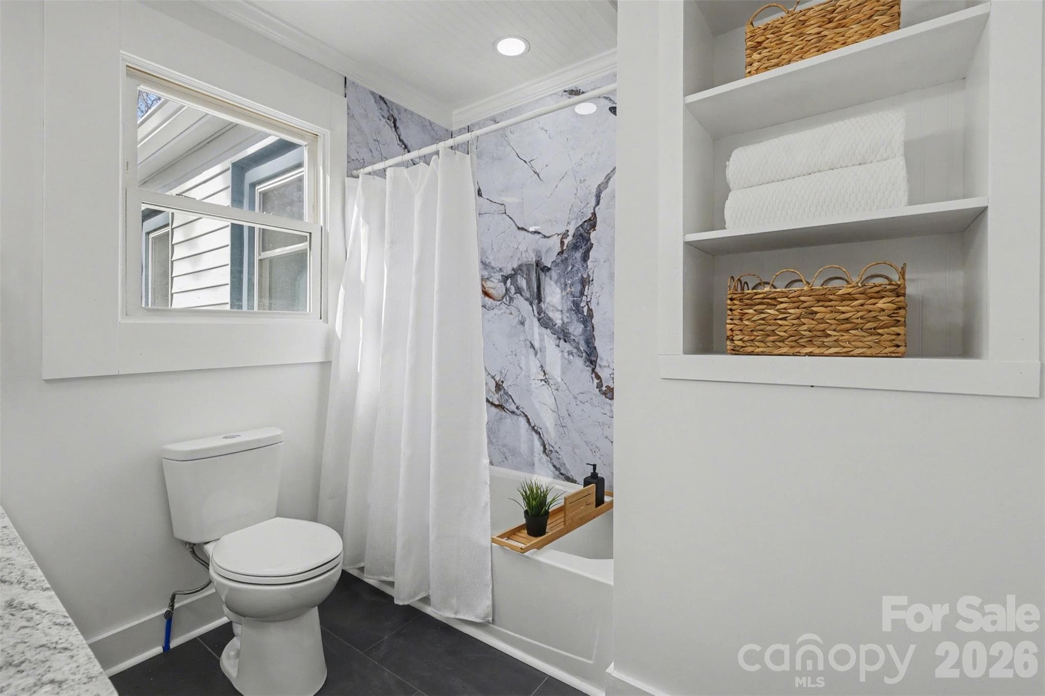 Primary Bathroom with tub shower unit and built in shelves - 622 Neelys Creek Road, Rock Hill