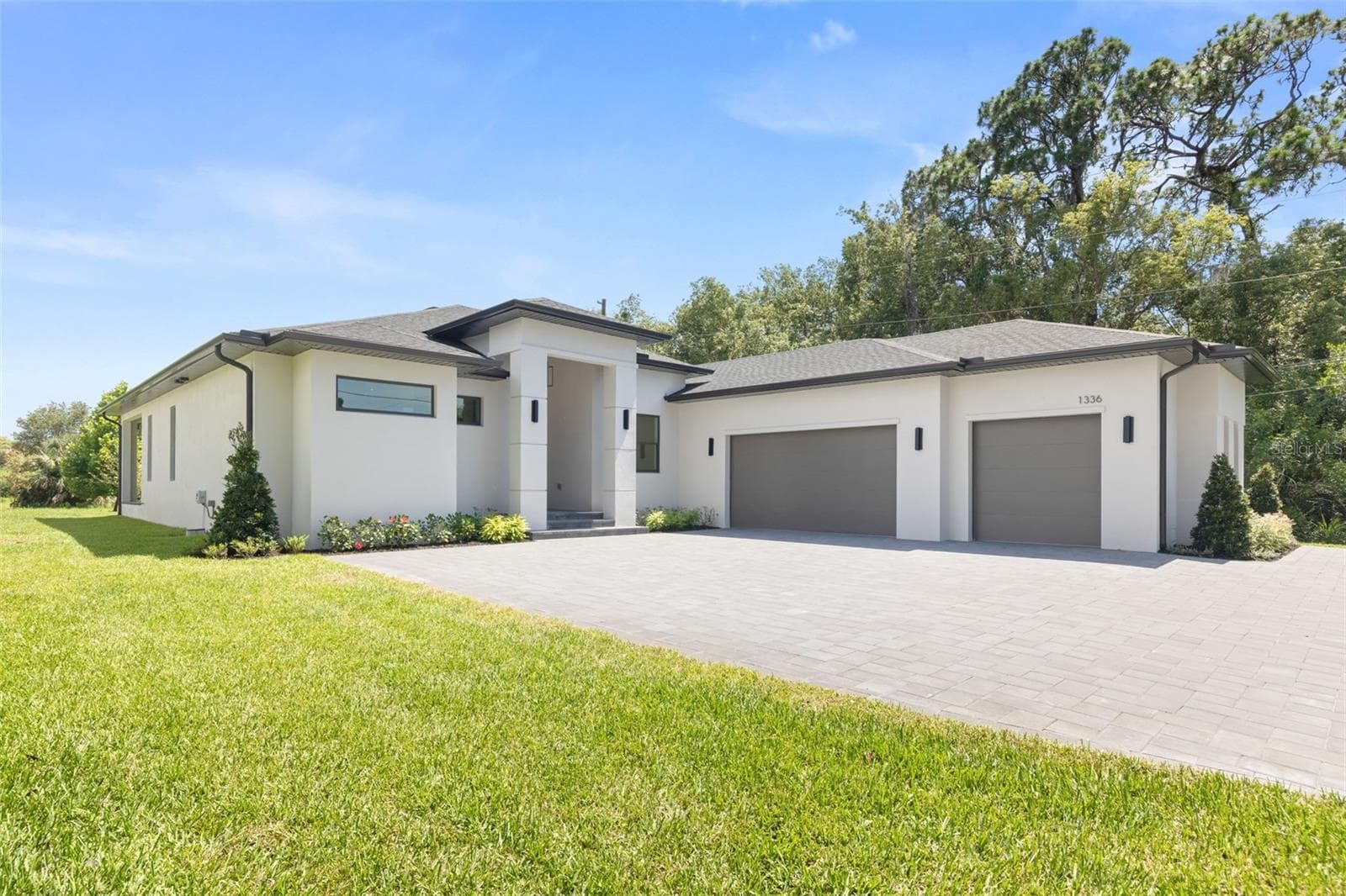 Welcome to this exceptional custom-built luxury residence, thoughtfully designed and constructed with top-rated materials, superior craftsmanship, and uncompromising attention to detail. - 1336 HAYS RD, TARPON SPRINGS