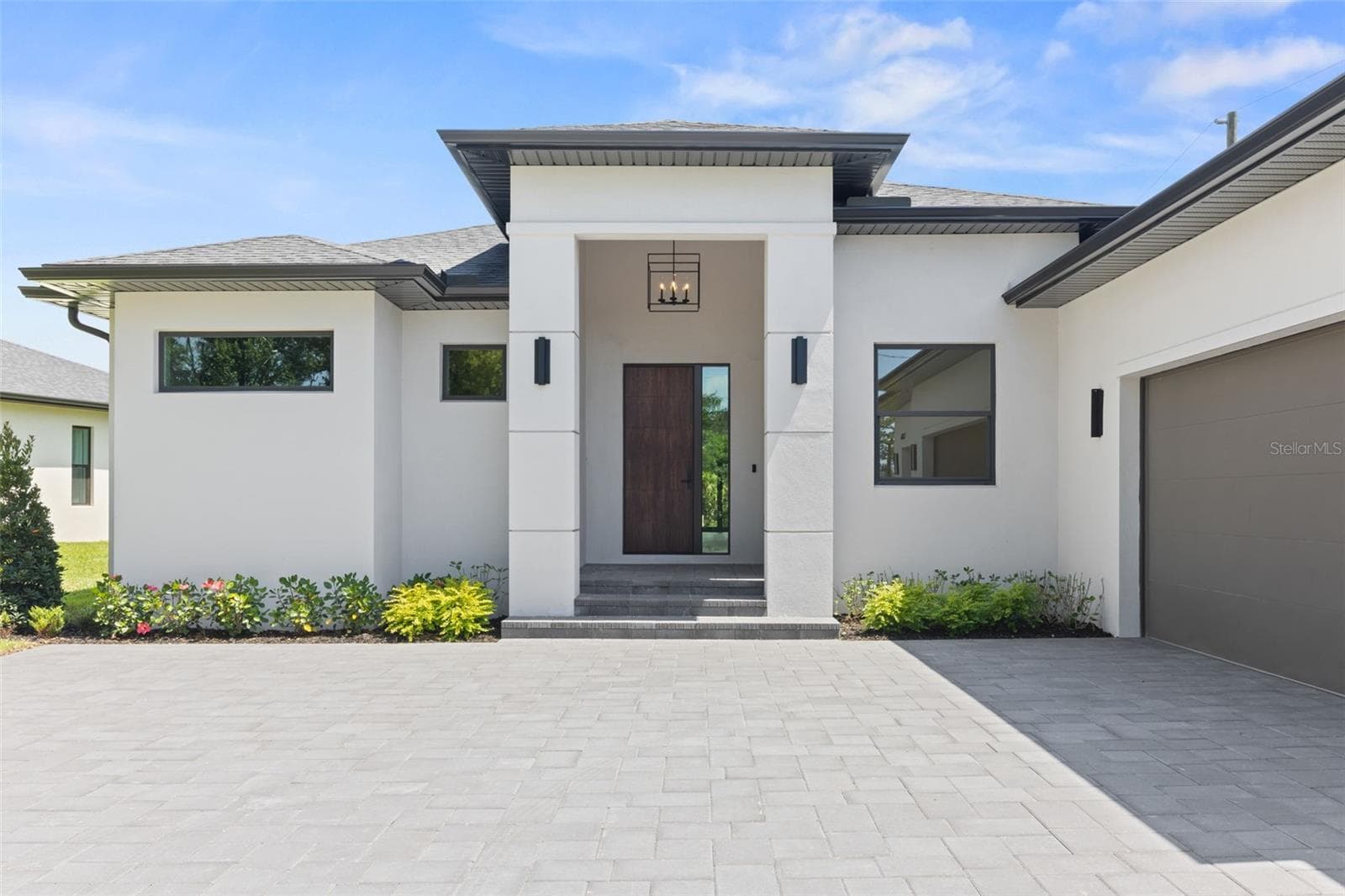 Premium Mastergrain Cherry fiberglass entry door with:Multipoint locking system, impact-rated Low-E sidelight,EMTEK designer hardware,realistic woodgrain finish with advanced, Nickel Vapor Deposition technology. - 1336 HAYS RD, TARPON SPRINGS