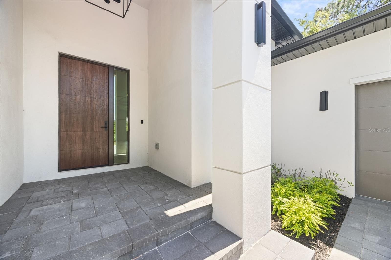 Premium Mastergrain Cherry fiberglass entry door with:Multipoint locking system, impact-rated Low-E sidelight,EMTEK designer hardware,realistic woodgrain finish with advanced, Nickel Vapor Deposition technology. - 1336 HAYS RD, TARPON SPRINGS