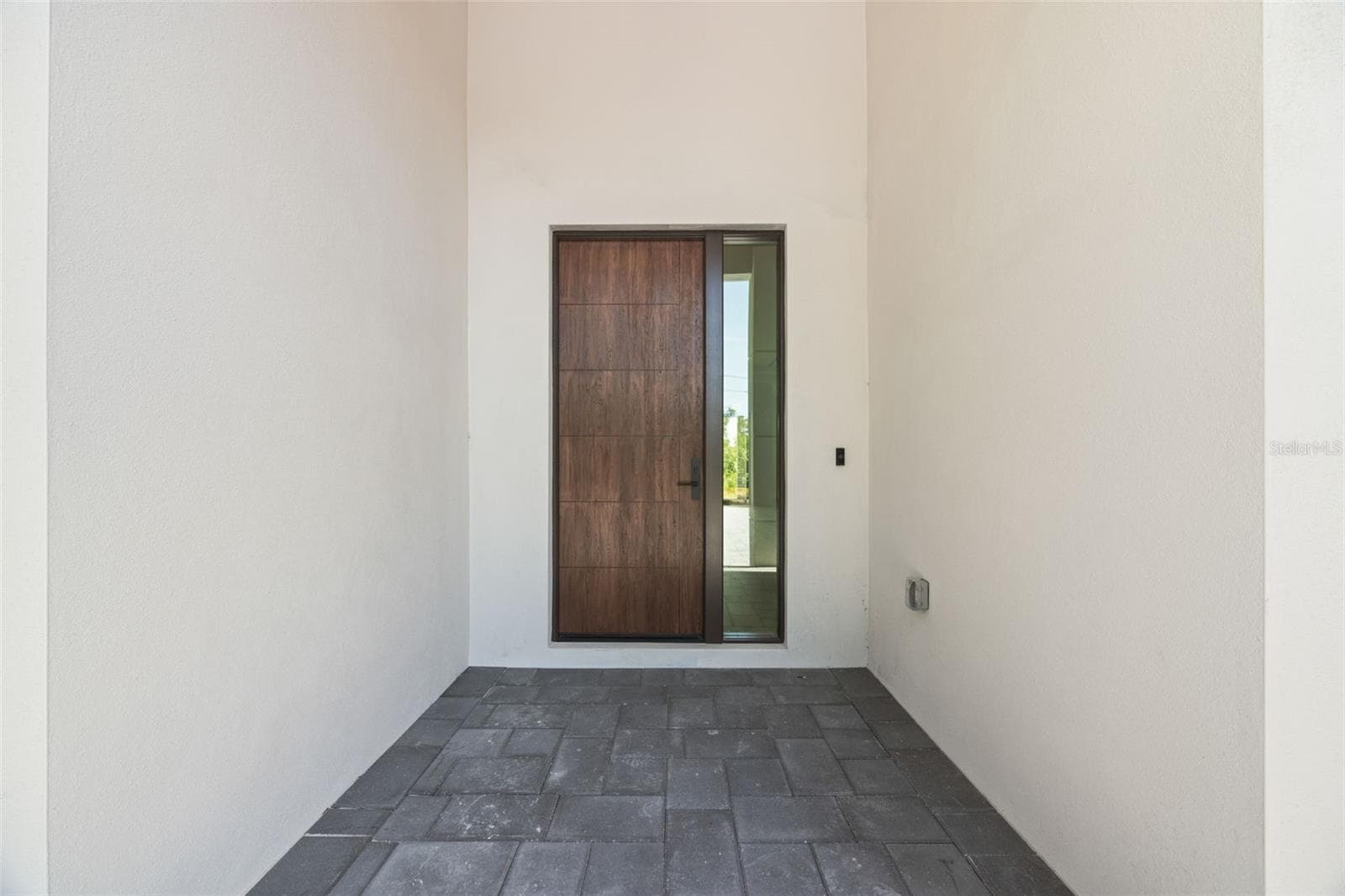 Premium Mastergrain Cherry fiberglass entry door with:Multipoint locking system, impact-rated Low-E sidelight,EMTEK designer hardware,realistic woodgrain finish with advanced, Nickel Vapor Deposition technology. - 1336 HAYS RD, TARPON SPRINGS