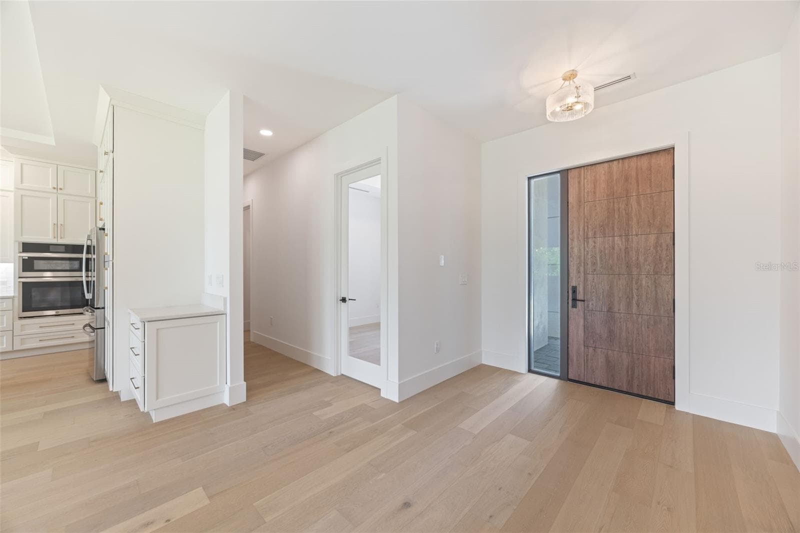 Entry Door / Office / Kitchen. - 1336 HAYS RD, TARPON SPRINGS