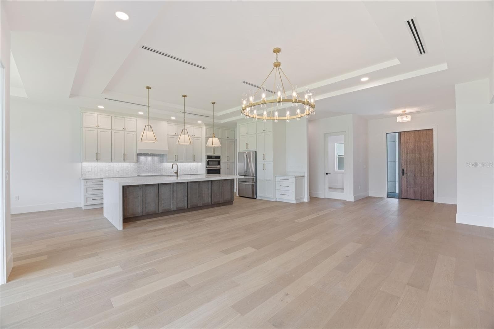 Living Room / Kitchen / Dining area/ Front door. - 1336 HAYS RD, TARPON SPRINGS
