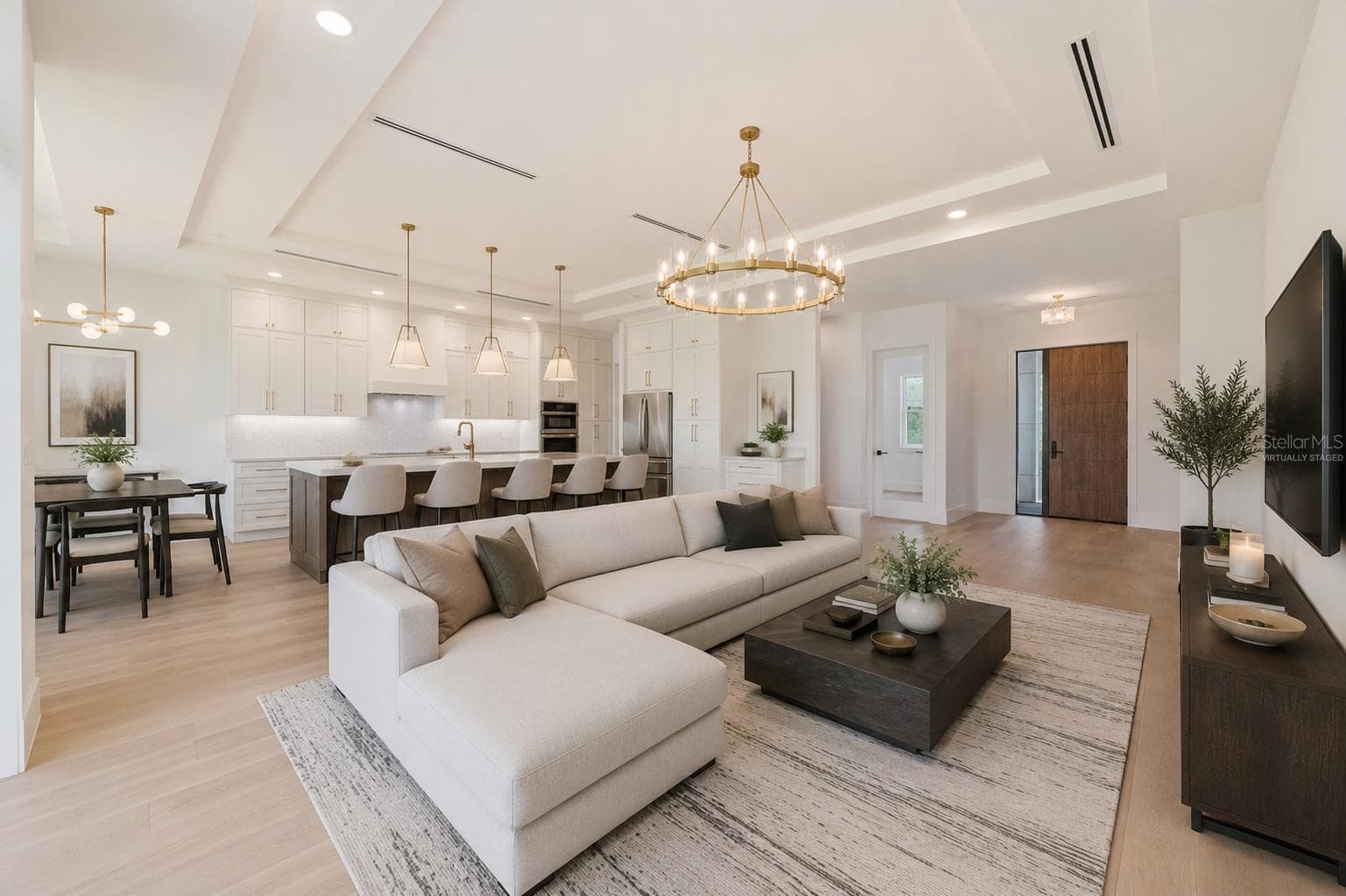 Virtually staged.Living Room / Kitchen / Dining area/ Front door. - 1336 HAYS RD, TARPON SPRINGS