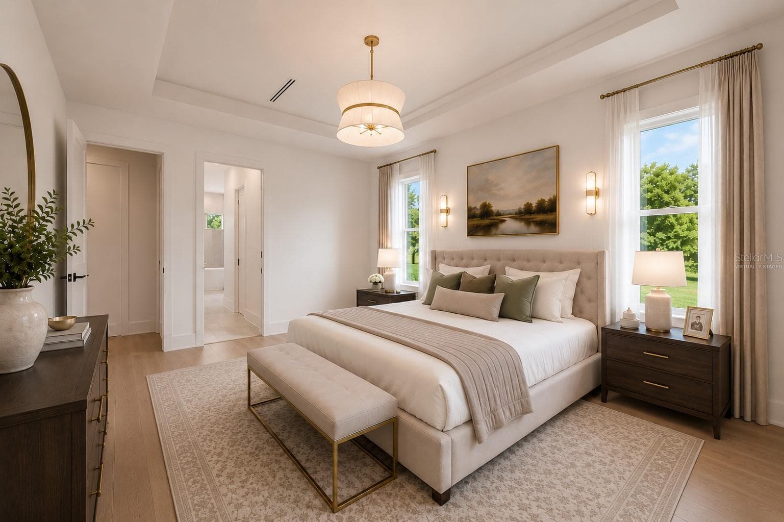 Virtually staged.The luxurious primary suite offers a spa-inspired retreat featuring a freestanding soaking tub, oversized walk-in shower with rain head and handheld shower, premium Italian tile, designer fixtures, and thoughtful custom details throughout. - 1336 HAYS RD, TARPON SPRINGS