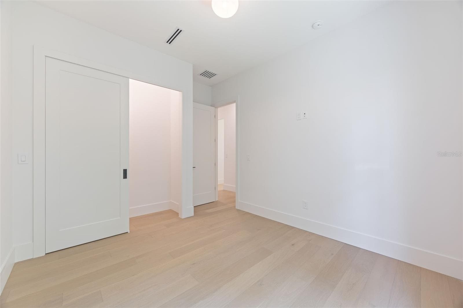 Bedroom 2 is generously sized and conveniently located near a full guest bathroom. - 1336 HAYS RD, TARPON SPRINGS