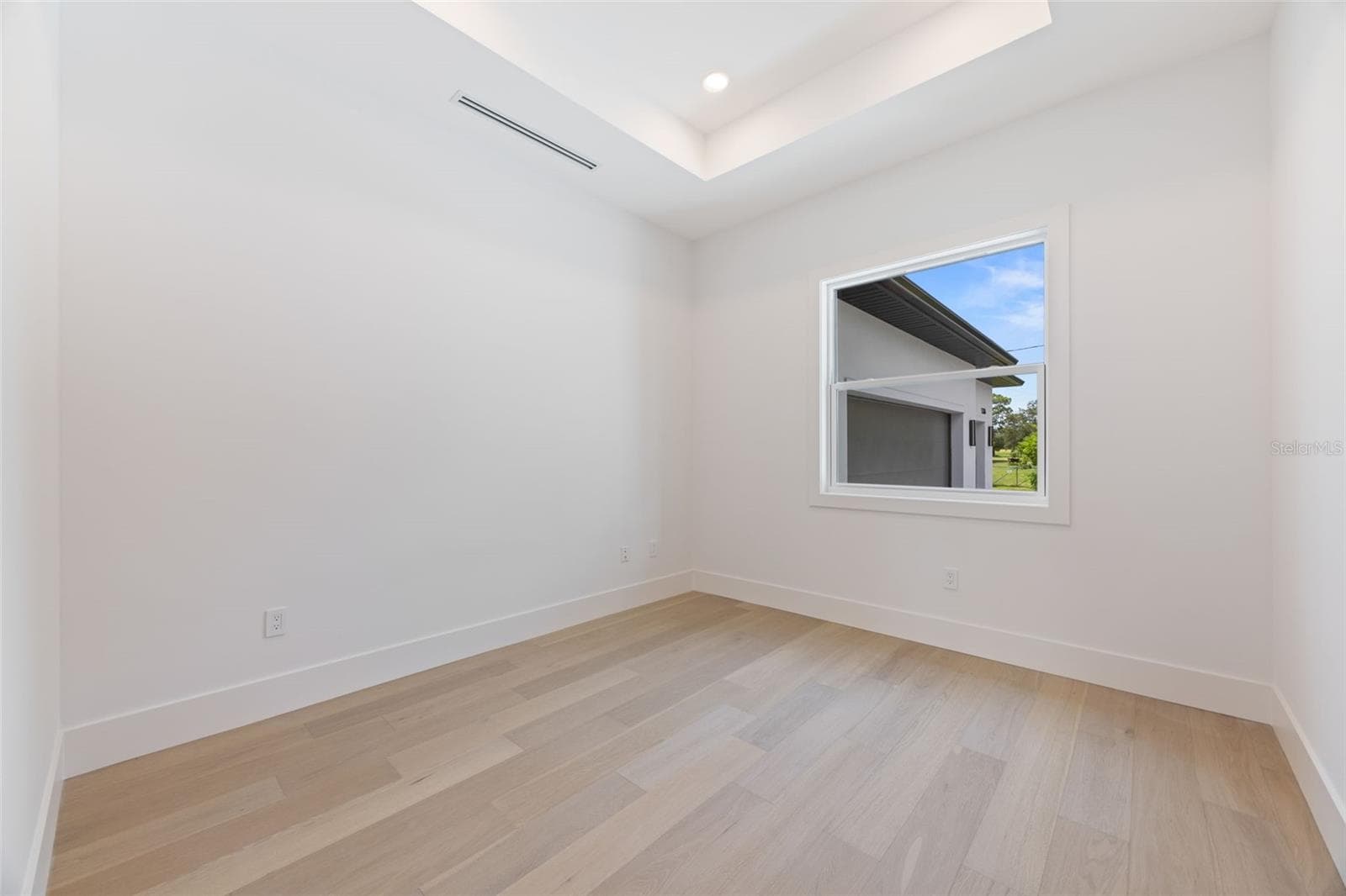 A dedicated office/study room provides the perfect work-from-home space while maintaining privacy from the main living areas. - 1336 HAYS RD, TARPON SPRINGS
