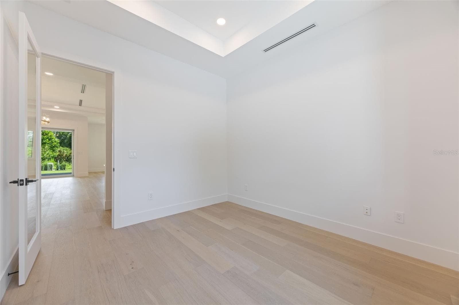 A dedicated office/study room provides the perfect work-from-home space while maintaining privacy from the main living areas. - 1336 HAYS RD, TARPON SPRINGS