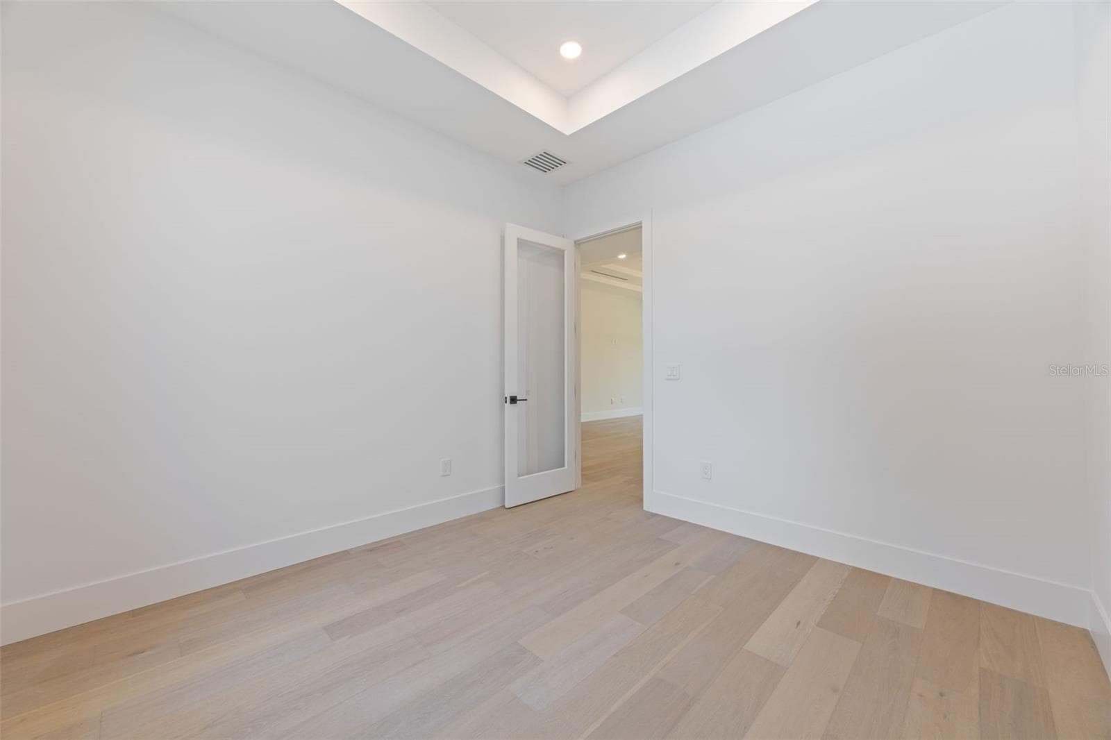 A dedicated office/study room provides the perfect work-from-home space while maintaining privacy from the main living areas. - 1336 HAYS RD, TARPON SPRINGS