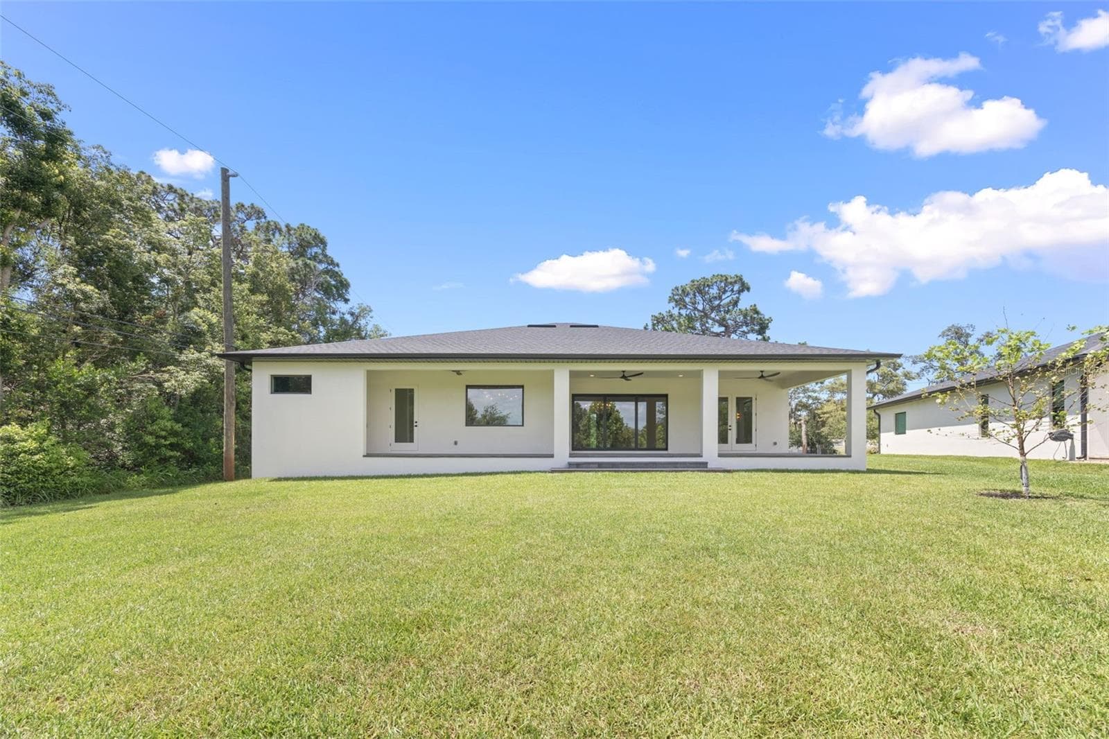 The oversized homesite backing to a conservation area provides a rare combination of privacy, natural beauty, and room to enjoy Florida living at its finest. - 1336 HAYS RD, TARPON SPRINGS