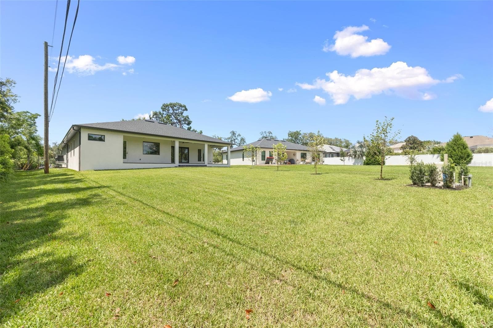 The oversized homesite backing to a conservation area provides a rare combination of privacy, natural beauty, and room to enjoy Florida living at its finest. - 1336 HAYS RD, TARPON SPRINGS