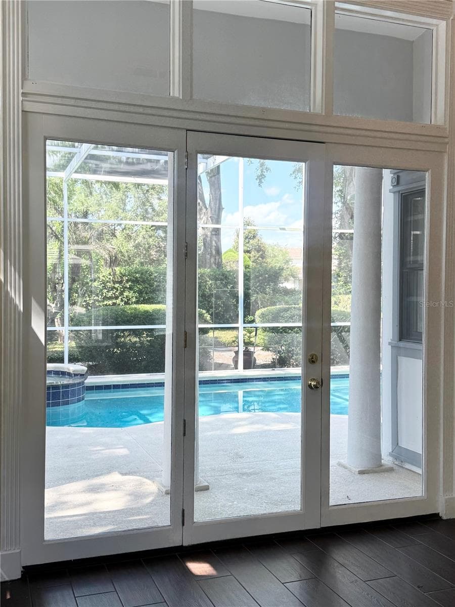 POOL VIEW FROM THE LIVING ROOM - 1250 E LANGLEY CT, LAKE MARY