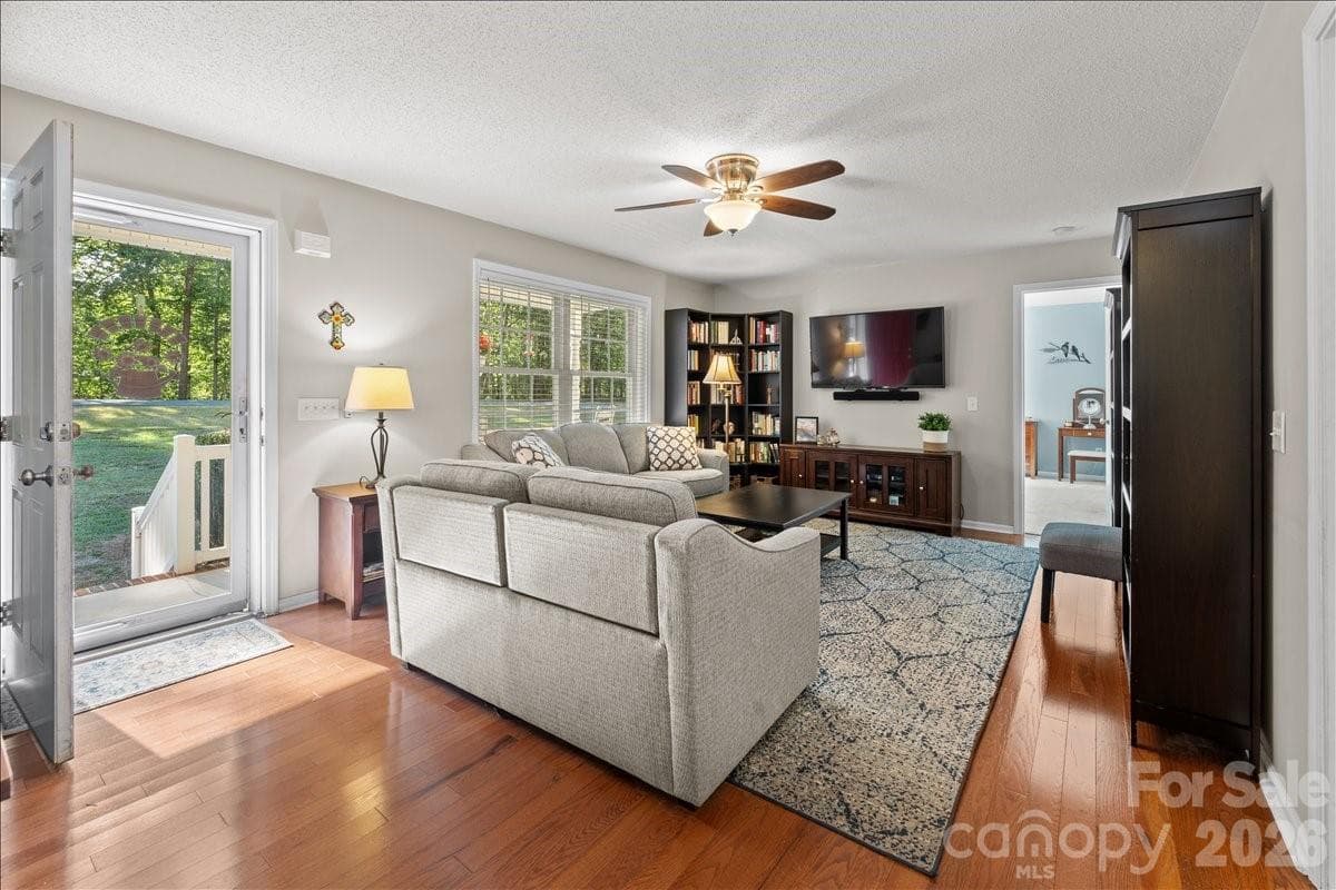 Front entrance into the living room with hardwood floors. - 104 Balsam Circle, Troy
