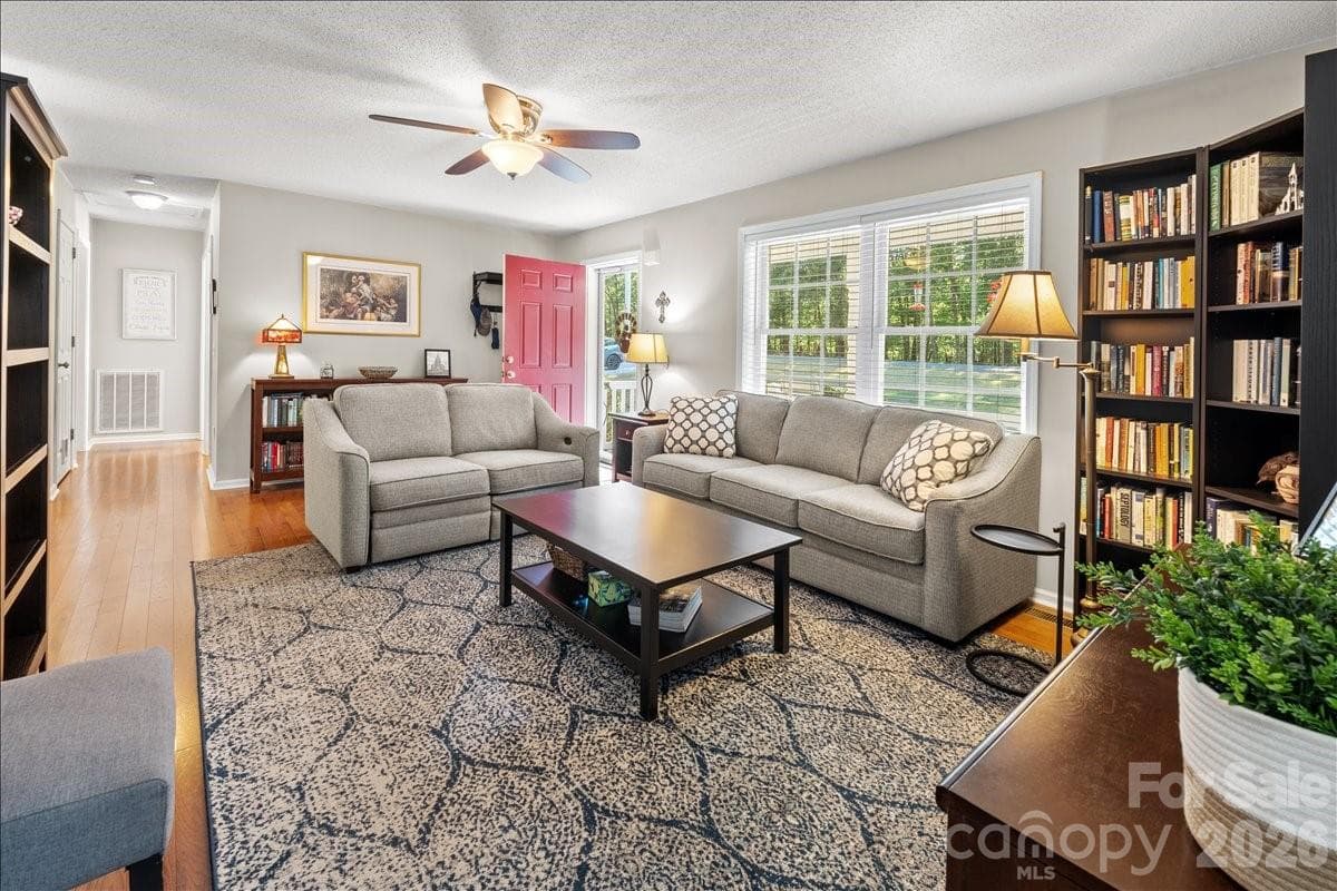 Another view of the living room. The storm door and windows provide nice light in this space. - 104 Balsam Circle, Troy