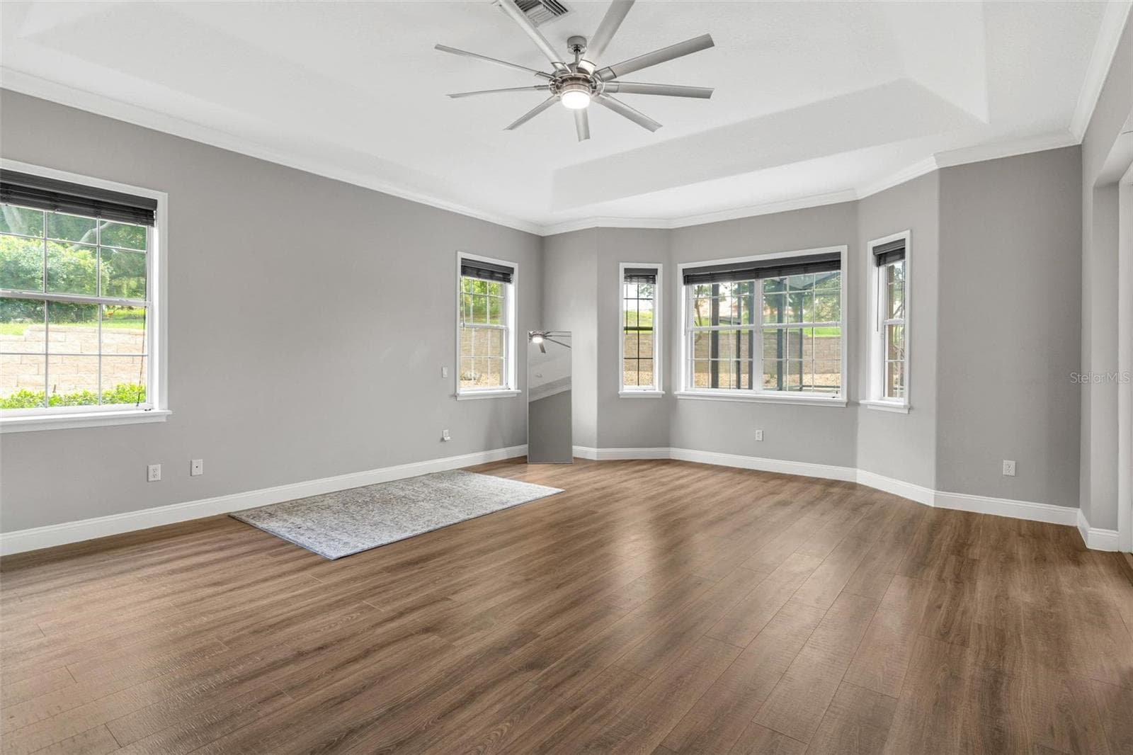 Primary Bedroom with Tray Ceilings - 5506 CITATION CT, LADY LAKE