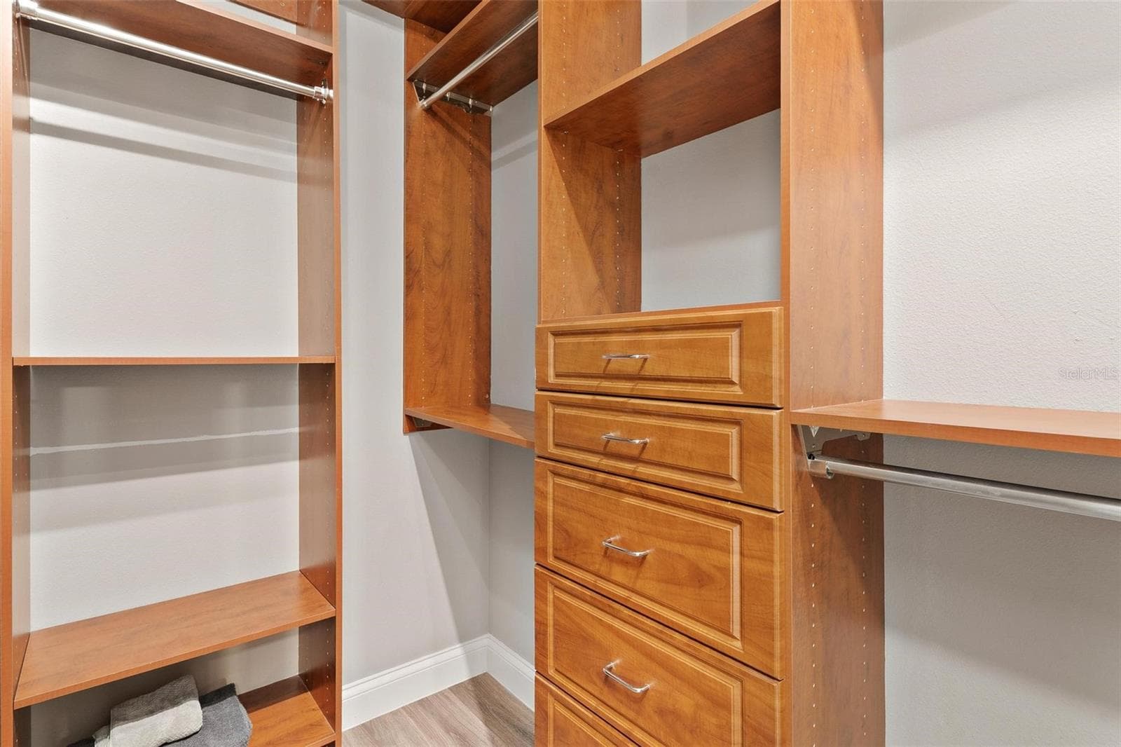 Primary Walk-In Closet with Custom Built-Ins - 5506 CITATION CT, LADY LAKE