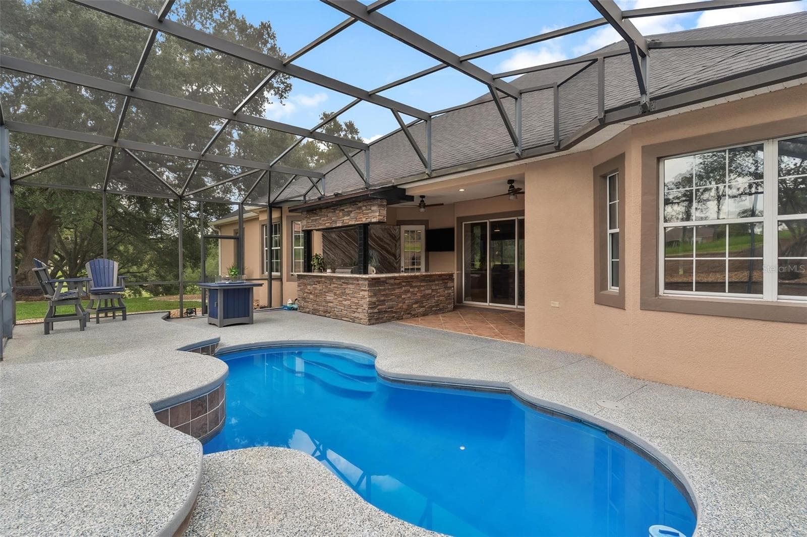 Enjoy a refreshing dip in the sparkling pool on warm Florida days. - 5506 CITATION CT, LADY LAKE