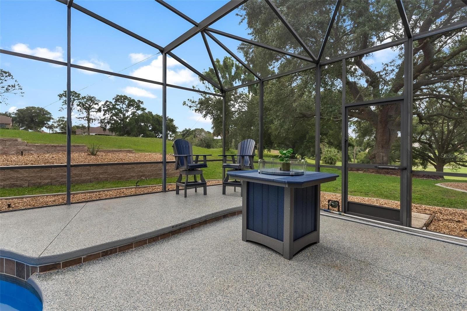 The inviting firepit area is the perfect spot for evening conversations and outdoor enjoyment. - 5506 CITATION CT, LADY LAKE