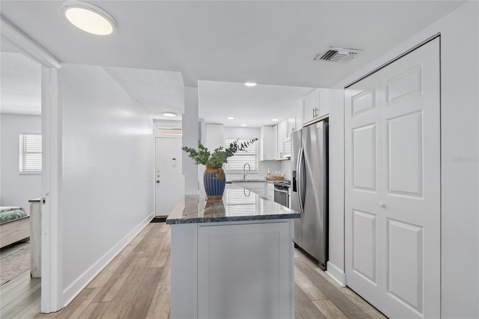 Island looking back at kitchen. - 5980 SHORE BLVD S #909, GULFPORT