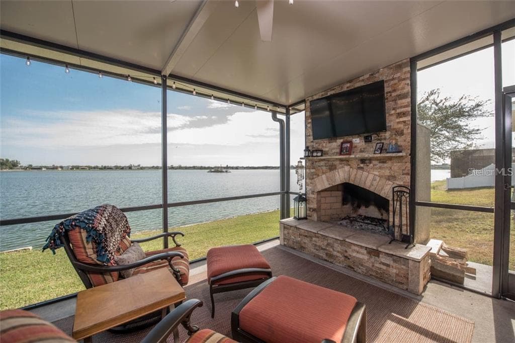 The lanai space is 24x14 and offers a custom wood burning fireplace with gorgeous water views! - 1742 MIRA LAGO CIR, RUSKIN