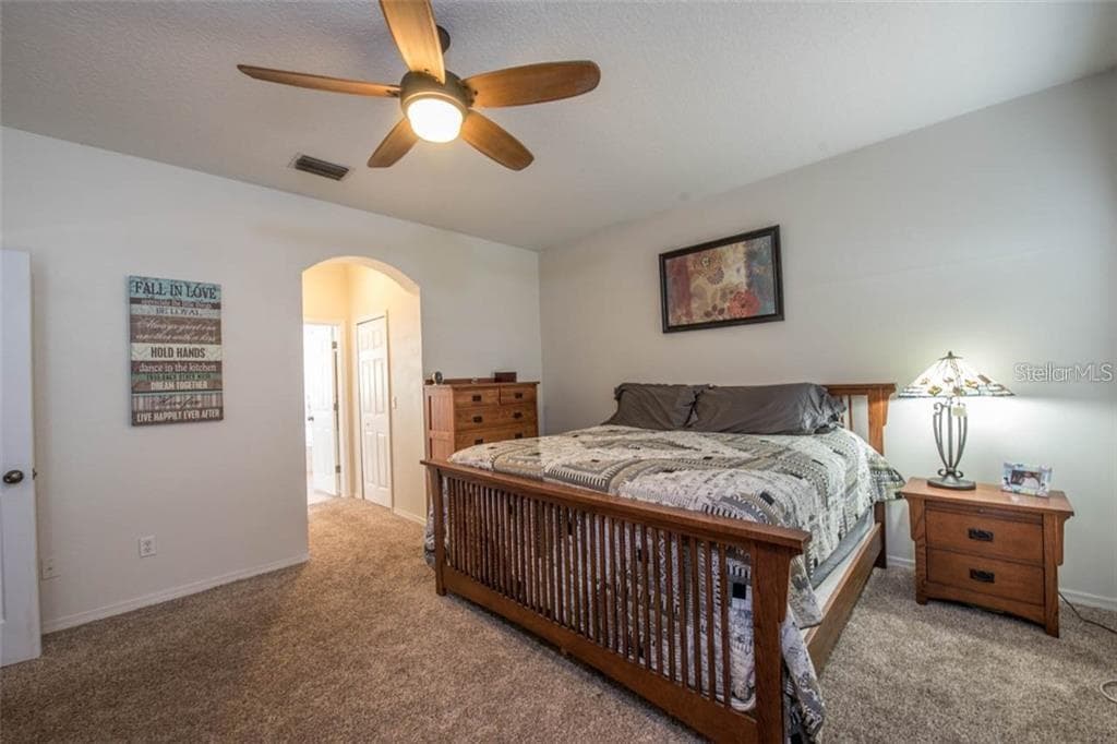 Master bedroom offers his and her walk in closets with gorgeous lake views - 1742 MIRA LAGO CIR, RUSKIN