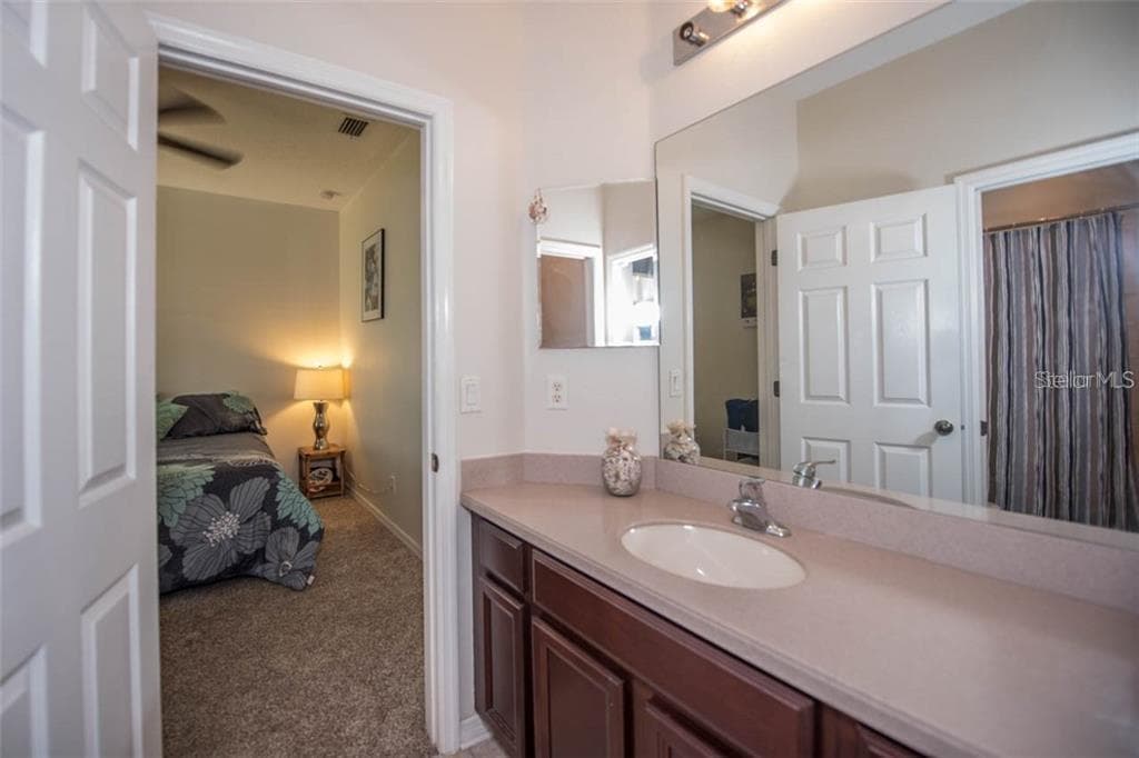 Private full bathroom for bedroom 4 that exits to lanai area - 1742 MIRA LAGO CIR, RUSKIN