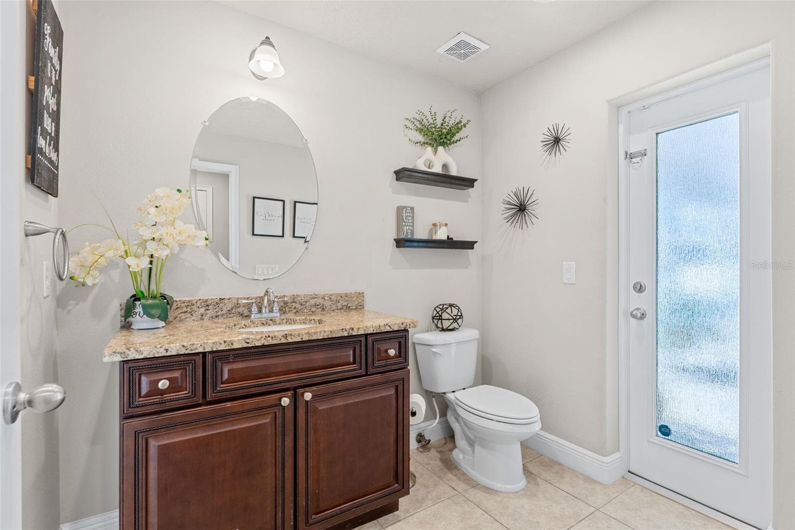 Downstairs guest bathroom also leads out to the pool area - 3897 PROVINCE DR, MELBOURNE
