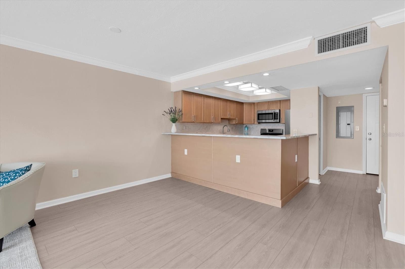 Dining area through kitchen - 450 TREASURE ISLAND CSWY #102, TREASURE ISLAND