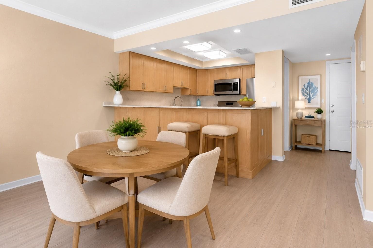 Dining area virtually staged - 450 TREASURE ISLAND CSWY #102, TREASURE ISLAND