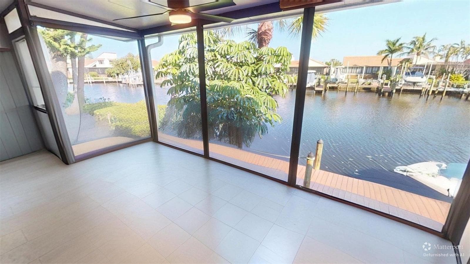 Lanai - this photo has been virtually staged by removing the furniture that is there now so that you can see what it looks like empty. - 25188 MARION AVE #1027, PUNTA GORDA