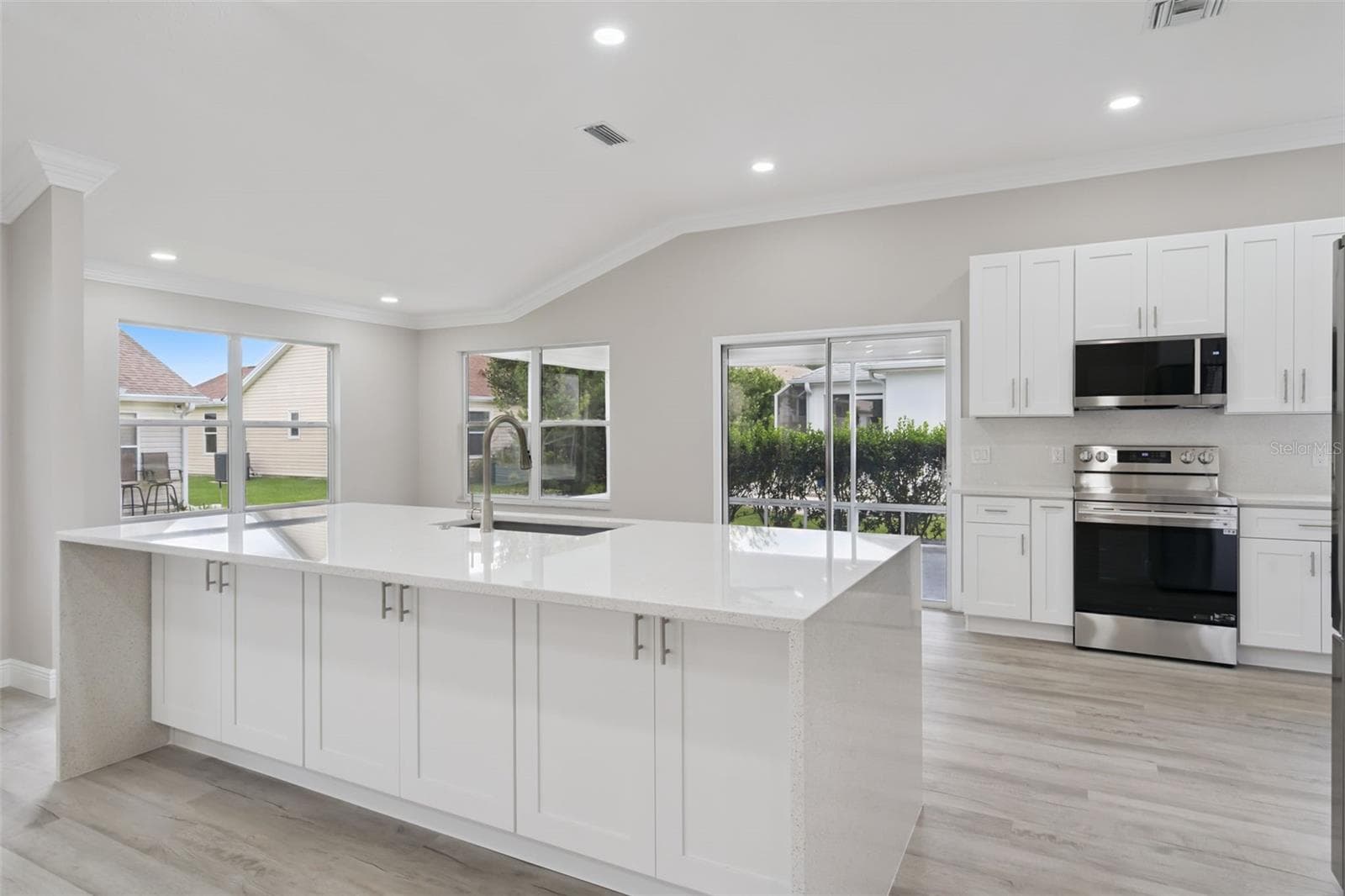 Oversized Quartz water island with cabinet storage on both sides - 1506 DELLANO WAY, THE VILLAGES