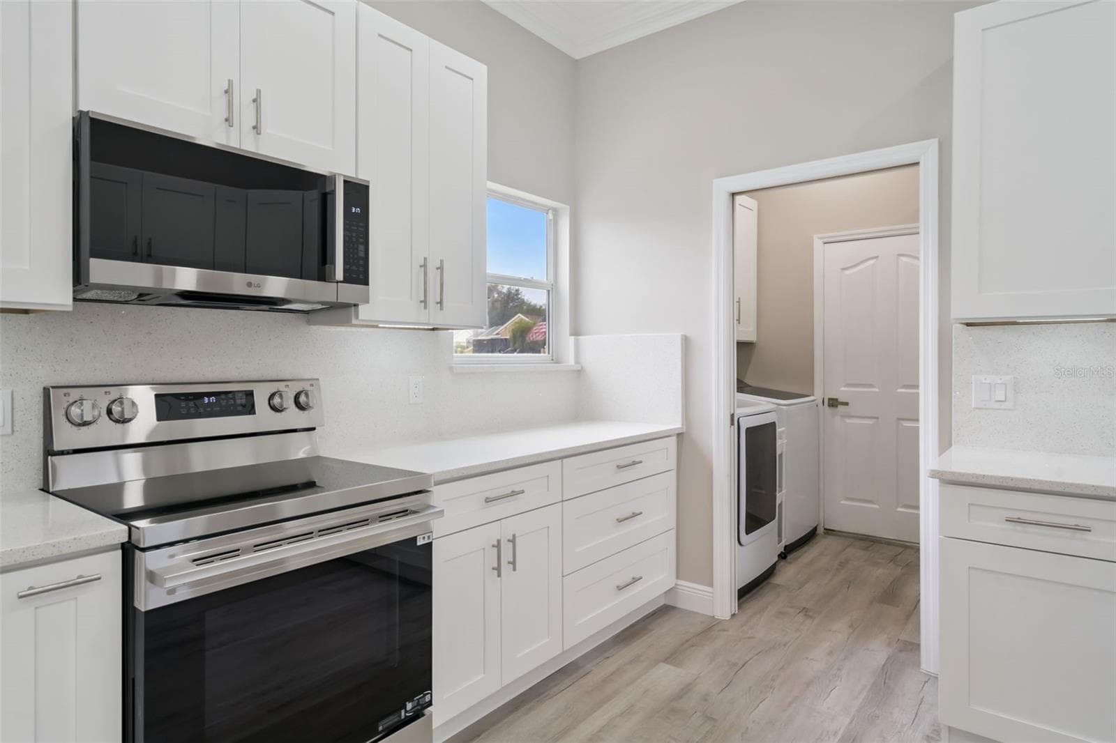 Open Pocket Door to Laundry Room - 1506 DELLANO WAY, THE VILLAGES