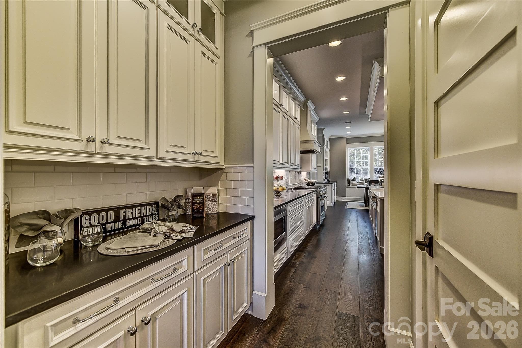 Representative PhotoButler's pantry with added cabinets and adjacent large closed pantry - Matthews