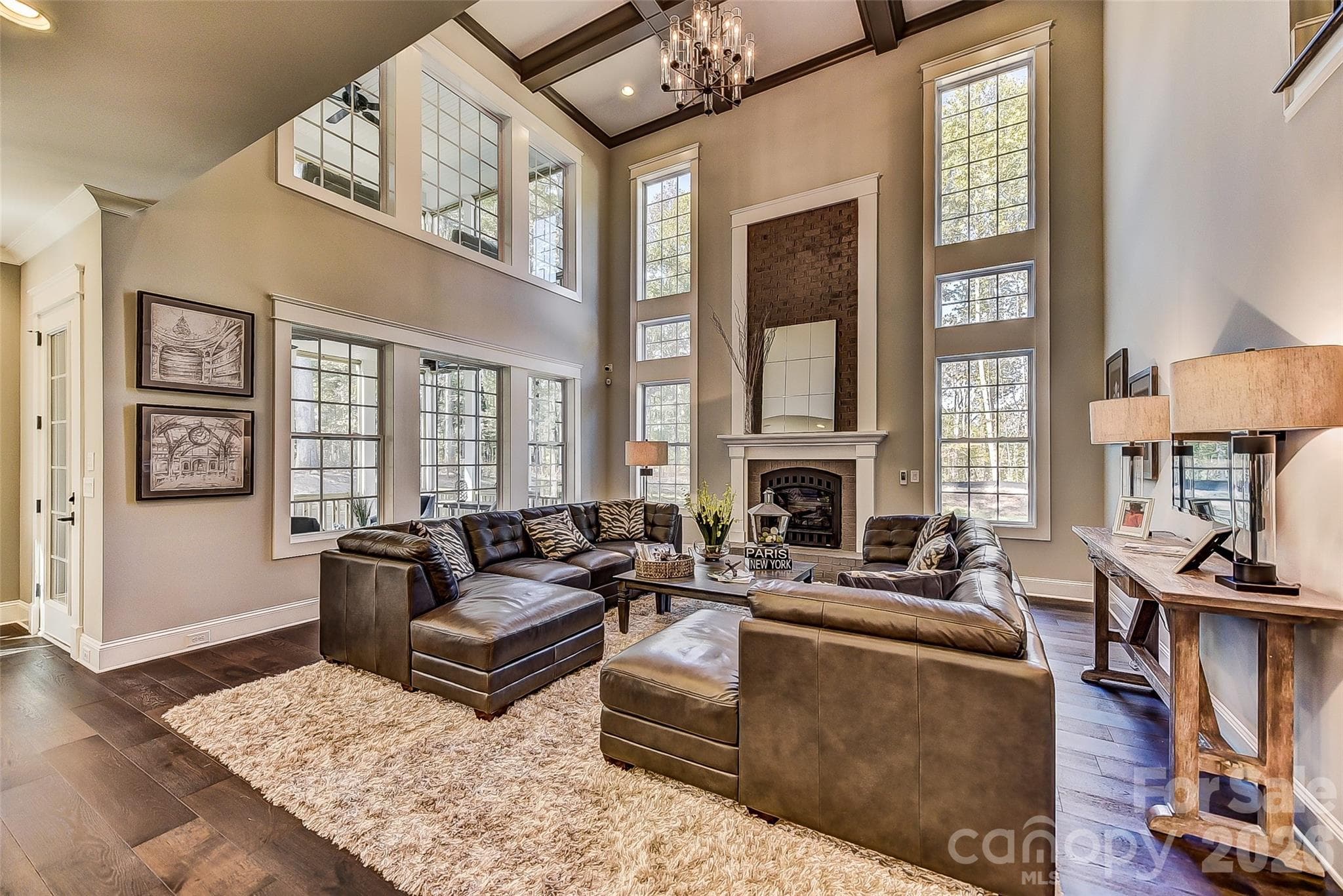 Representative PhotoFamily Room has abundant windows and High, Coffered Ceilings - Matthews