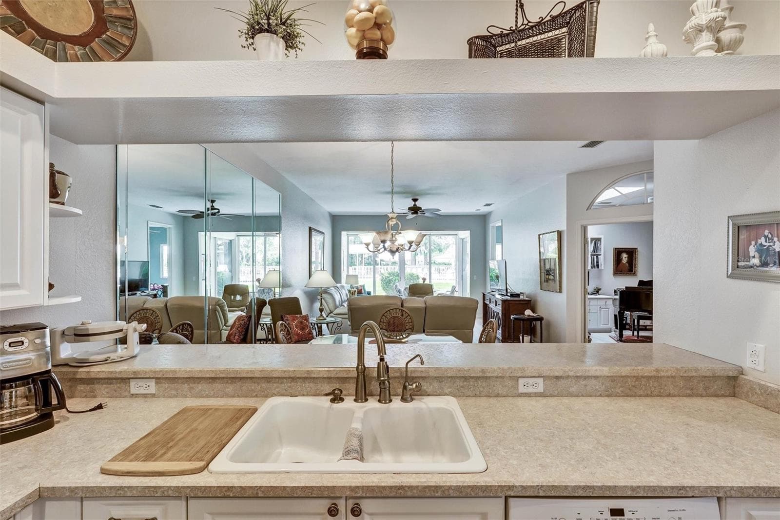 PASS WAY TO DINING ROOM FROM KITCHEN - 6929 STONEYWALK CT, BRADENTON