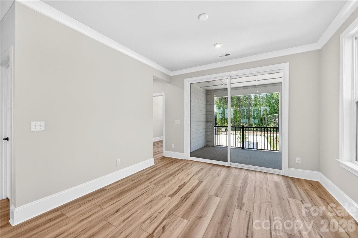 Dining space with access to the covered outdoor living - 12015 Elsa Lane, Charlotte