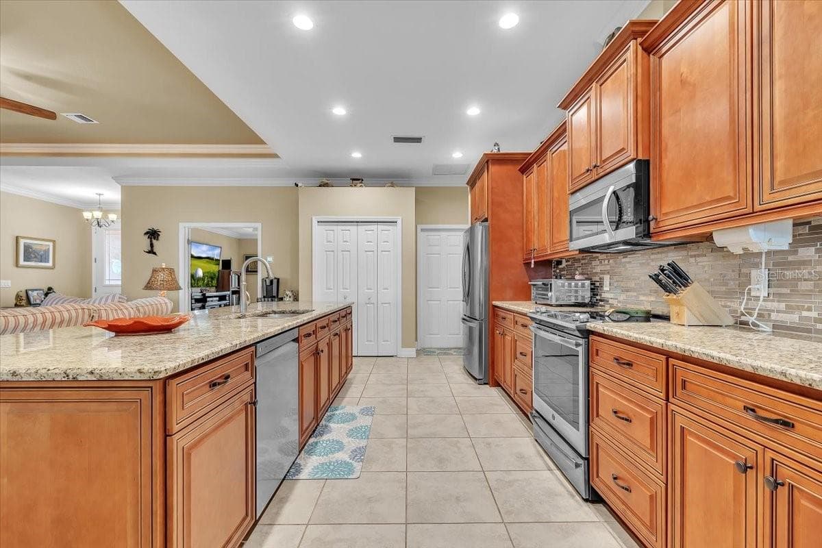 Single Family Residence at 11614 SW COURTLY MANOR DR, LAKE SUZY, photo 9 of 49